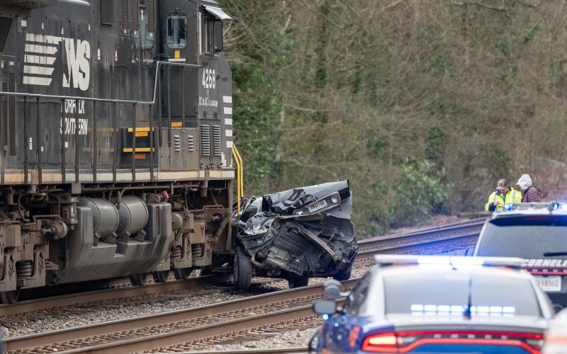 A train struck a Lincoln sedan at the railroad crossing on Main Street in Cornelia. No injuries were reported, with the sole occupant of the vehicle refusing medical care from Habersham’s Med 12. The crushed car is seen approximately 200 feet from the impact location. ZACH TAYLOR/Staff