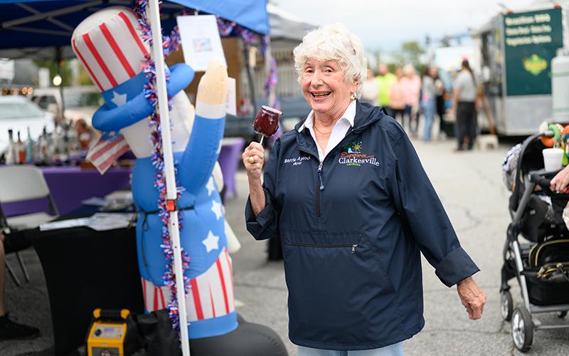 Clarkesville Mayor Barrie Aycock will not run for another term as mayor in the next election. Franklin Brown was named Mayor Pro-tem at the Jan. 6 meeting. Pictured here, Mayor Aycock holds a candy apple while donning an ‘Experience Clarkesville’ windbreaker. ZACH TAYLOR/Staff