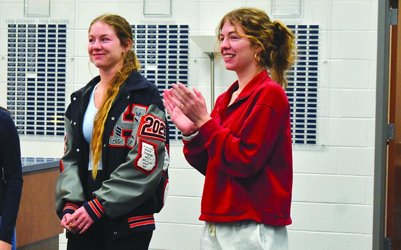 Abigail Hotard (right) claps as her sister, Audrey, is announced Habersham Central High School’s valedictorian Wednesday morning. Abigail was announced as the class salutatorian. Samantha Sinclair/Staff