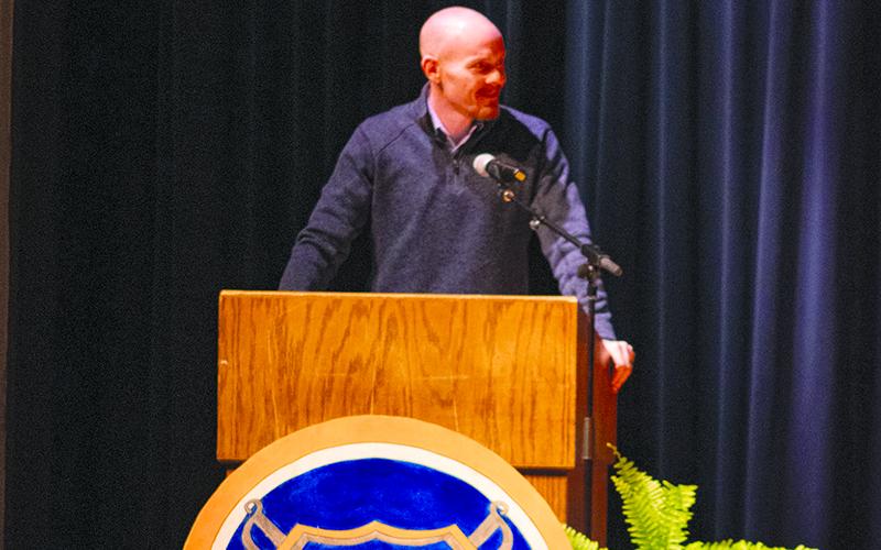 Habersham Central High School Principal Dr. Adam Bagwell smiles toward the students on center stages as the spelling bee begins. HANNAH CAUDELL/Staff