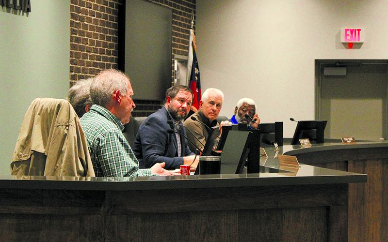 Cornelia commissioners look over to Mark Reed, who explains to city citizens why the commissioners decided to hold the public hearings before making a final decision on the bill. Hannah Caudell/Staff