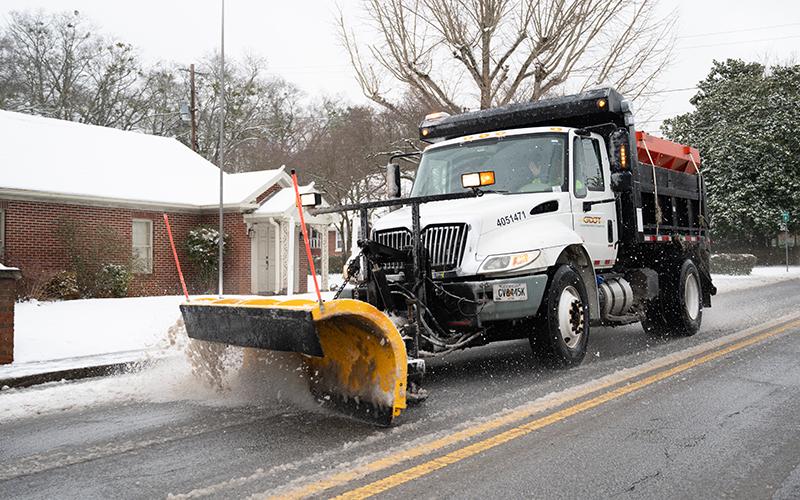 A GDOT plow makes its way down Washington Street in Clarkesville. ZACH TAYLOR/Staff