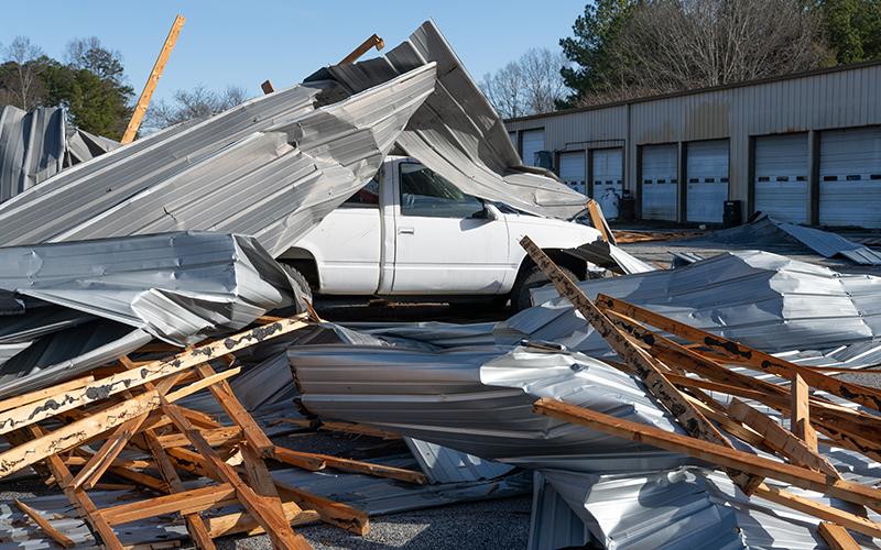 A truck at Cap’n Auto Parts is buried beneath rubble from the roof. ZACH TAYLOR/Staff