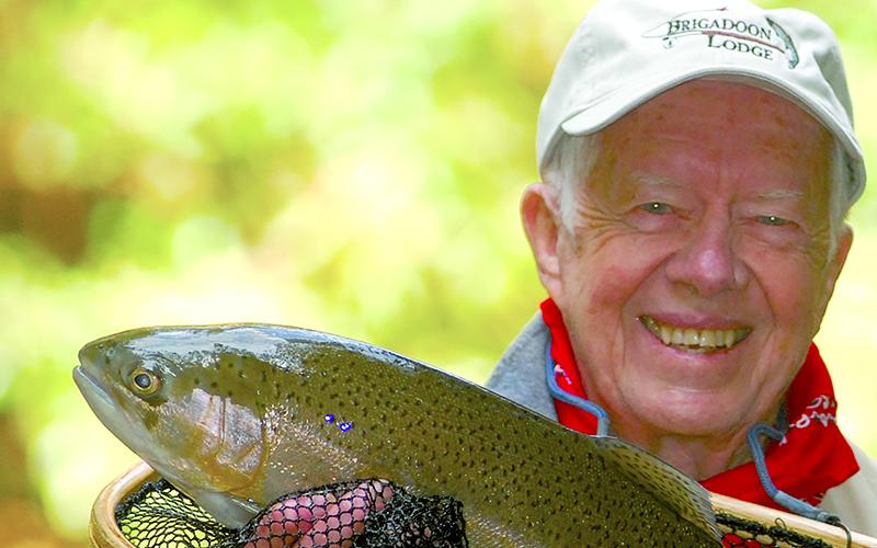 Jimmy Carter proudly shows a fish he caught in local waters. “He is holding an Oyster rod that I specially commissioned for him,” Rebekah Stewart said. “It is one of only two rods I ever commissioned.” SUBMITTED
