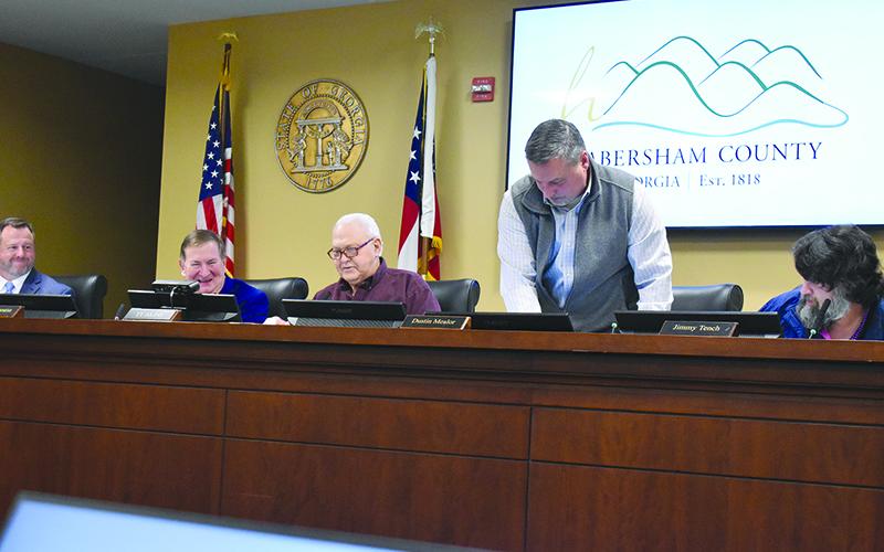 Immediately following the election of chairman, commissioners Jimmy Tench, Ty Akins and Dustin Mealor switched seats so Tench could take his place as chairman. Samantha Sinclair/Staff