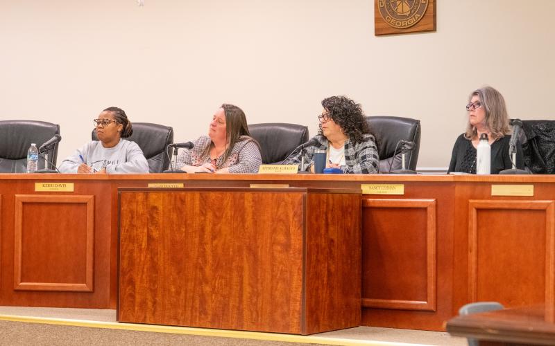 Mayor Stephanie Almagno and Councilwomen Kerri Davis, Alice Venter and Nancy Lehman listen intently to Baldwin Resident Paul Wolf about his garbage disposal issues. ZACH TAYLOR/Staff