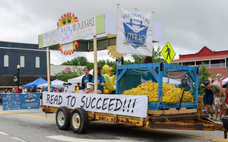 The Volunteers for Literacy float makes its way through the Mtn Laurel Festival parade with many ducks for the VFL Duck Race. ZACH TAYLOR/Staff