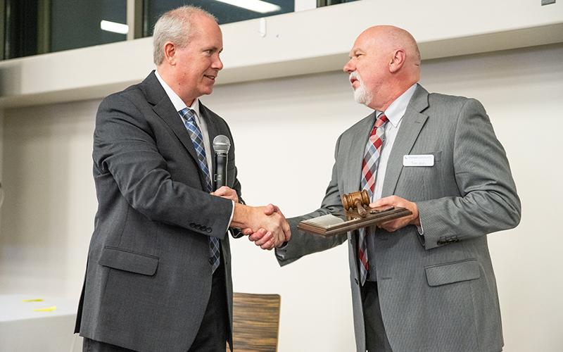 Past Chairman Tim Ash, right, passes the gavel to now-current Chairman Tommy Thurmond. ZACH TAYLOR/Staff