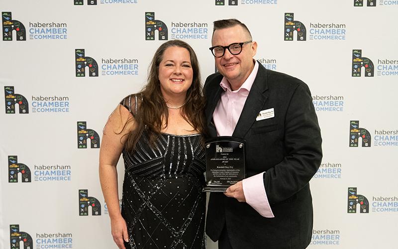 Chamber President Ellie Van Doornum (left) presents Randall Roy Fry (right) with the Chamber Ambassador of the Year Award. ZACH TAYLOR/Staff