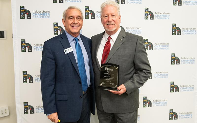 Charlie Fiveash presents Ken Schubring of Fieldale Farms Corporation with the Industry of the Year Award. ZACH TAYLOR/Staff