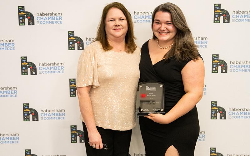 Susan Ramsey presents Marcia Hamil with the Professional Woman of the Year Award. ZACH TAYLOR/Staff