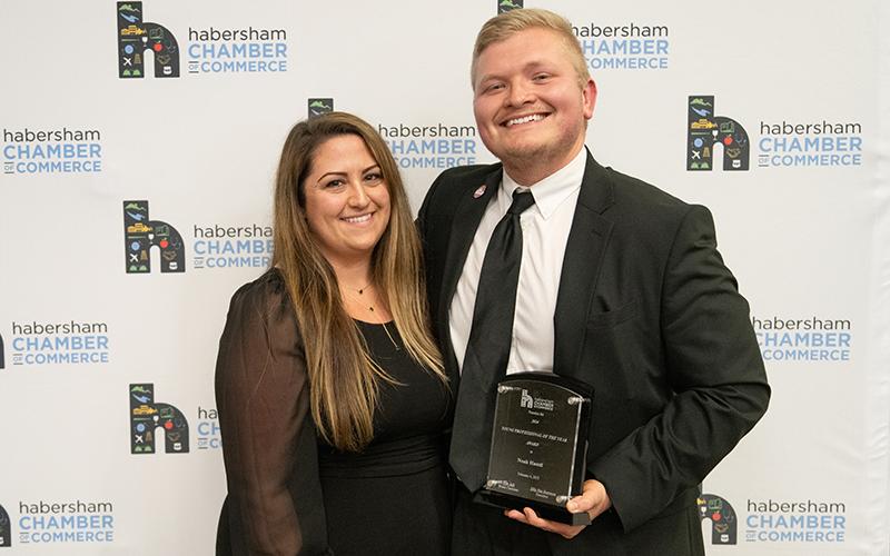 Alex Michelle presents Noah Hamil with the Young Professional of the Year Award. ZACH TAYLOR/Staff