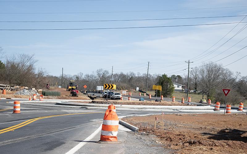 Construction on the roundabout at Ga. 115 and 105 is nearing completion, and Georgia Department of Transportation was ready to open the new lane merging into the roundabout Friday morning. HANNAH CAUDELL/Staff