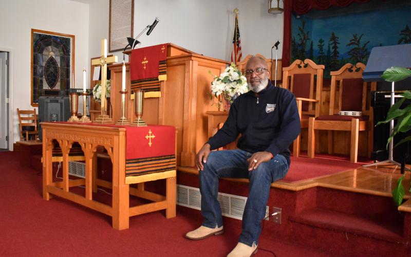 Bishop Ernest Burns sits in the sanctuary of Shady Grove Baptist Church in Cornelia. As the church looks for a new pastor, he continues to preach on Sundays. Samantha Sinclair/Staff