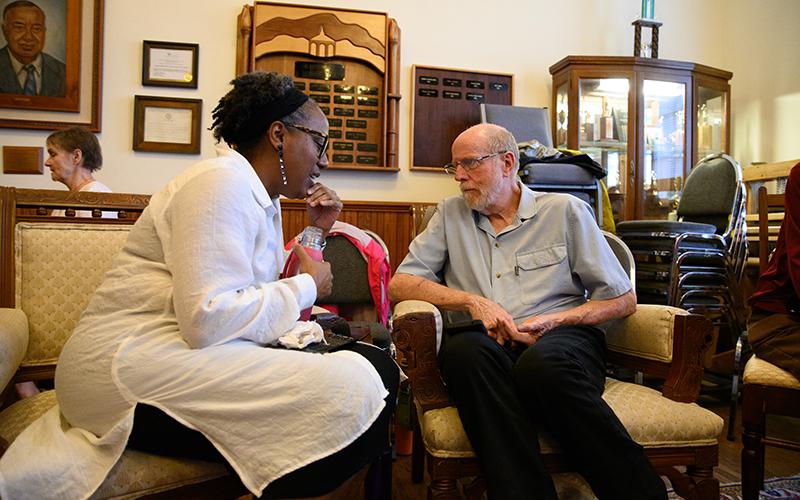 Audrey Davenport (left) speaks with Jim Johnston (right) during the ‘Think and Listen’ seminar at Sautee Nacoochee Center in honor of Juneteenth last year. The ‘Think and Listen’ session allowed patrons to voice their opinions and discuss matters about race, religion, and other topics with an engaged partner.  ZACH TAYLOR/Staff