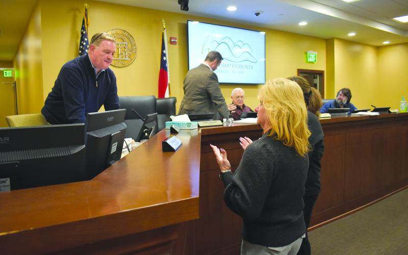 As the board exits the room for executive session, Interim County Manager Tim Sims assures Reign Elite Owner Neva Daniels that safety is the county’s top concern in repairs to the gymnastics facility. Samantha Sinclair/Staff