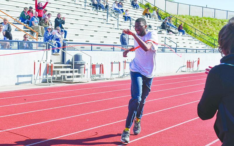 Jeremiah King crosses the finish line to win last year’s 200 meter dash during the Habersham Special Olympics. FILE