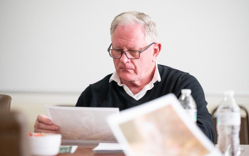 Councilman Don Nix reviews a plot map for a property on Robertson Loop Road. ZACH TAYLOR/Staff