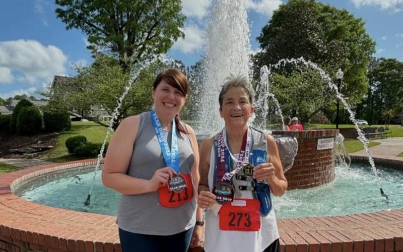 Whitney Jordan and Karen Swann (right) have become close running comrades over the past few years. SUBMITTED