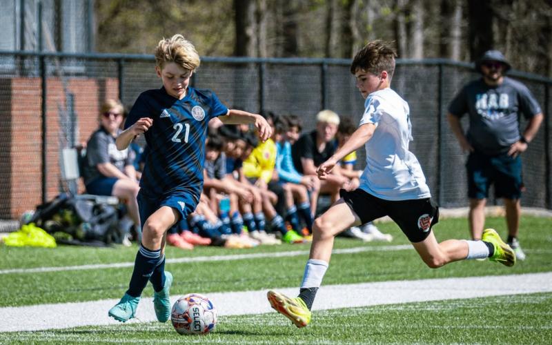 Patrick Schupp speeds past the Hart County attack. HABERSHAM SOCCER