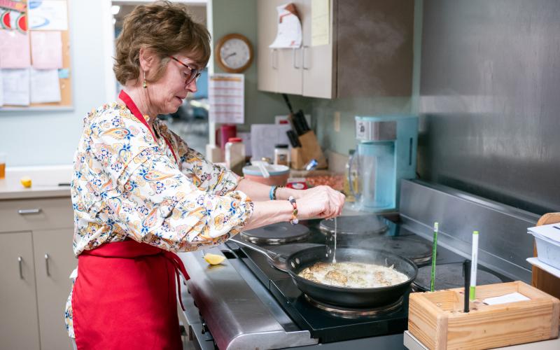 Chef Inger Smith prepares a meal in the Senior Center’s kitchen. Smith is all about preparing healthy meals for everyone. ZACH TAYLOR/Staff