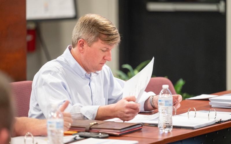 Demorest Mayor Jerry Harkness reviews paperwork on the grants. ZACH TAYLOR/Staff