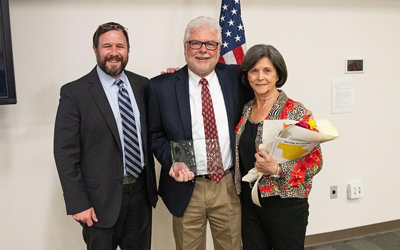 Cornelia Mayor John Borrow stands with Distinguished Citizen Award Terry Hayes, center, and his wife Sandra. ZACH TAYLOR/Staff