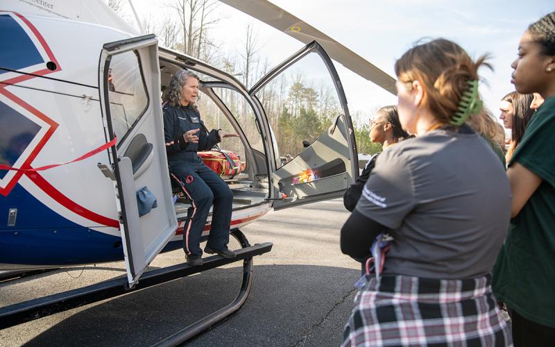 AirLife Flight Paramedic Jennifer Davis explains the uses of the life flight helicopter and the limits of medical technology on the chopper to Piedmont University nursing students. ZACH TAYLOR/Staff