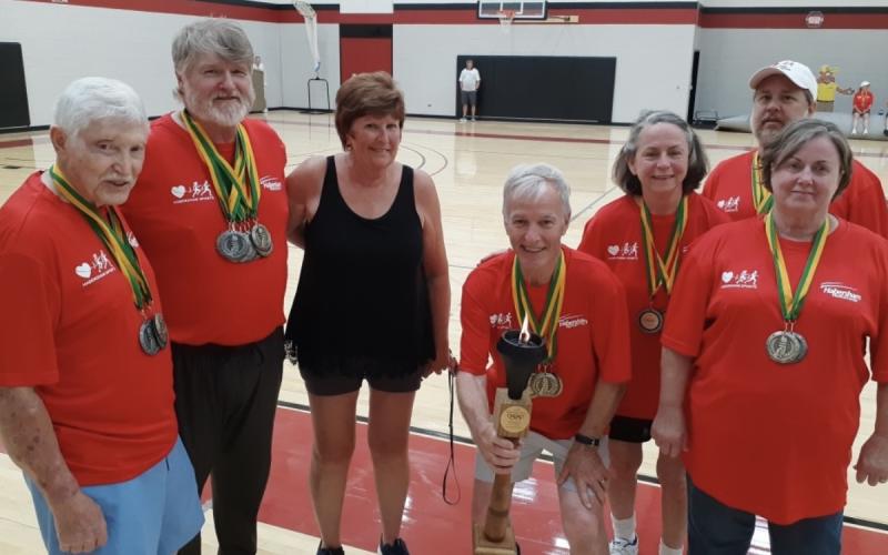 Evan Woodring, Joel Byers, Francis Welch, Robert Nichols, Patti Roy, Alan Irvin and Gayle Whitener snapped a photo after medaling in volleyball at the 2022 World Heart Games. SUBMITTED