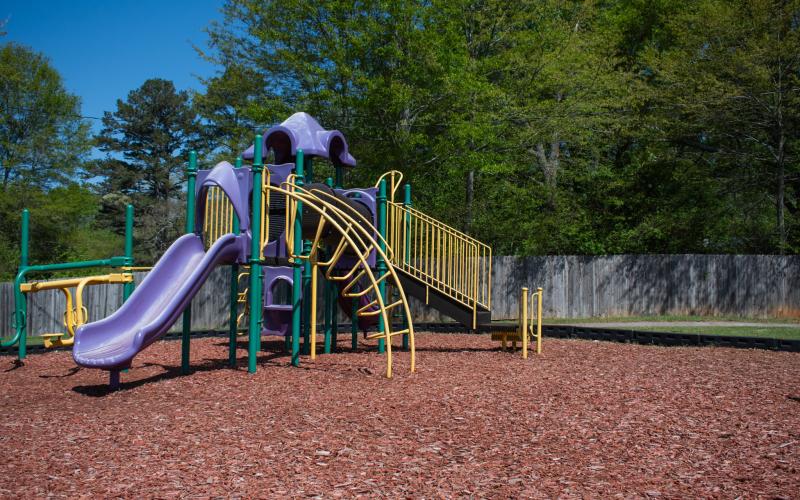 At Alto’s Lee Dorsey Cook playground, the old fence stands in the background of the attractions. The Alto Town Council just elected to replace the fence with black chain link, costing the town a total of $21,215. HANNAH CAUDELL/Staff