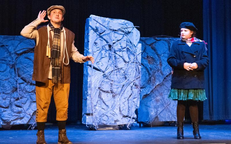 Jonas Corbin (left) plays Dickon in the show. Emma Johnson (right) stars in her first lead role as Mary Lennox. Dickon and Lennox are seen listening to the robin on top of the garden’s wall. ZACH TAYLOR/Staff