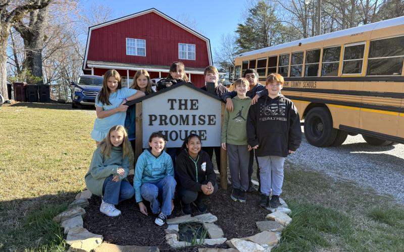 Students of the Hazel Grove Elementary Teach One to Lead One program stand with the Family Promise sign outside of the Family Promise of White and Habersham facility, a nonprofit dedicated to remedying homelessness in the North Georgia region. Pictured from left to right are (front) Violet Ramey, Brin Forrester, Aiyana Sutton, (back) Chloe Baird, Willow Ingebrigsten, Riley Gallahan, Konnor Tucker, Mason Harris, Matheo Garcia Vega and Ayden Meiburg. SUBMITTED