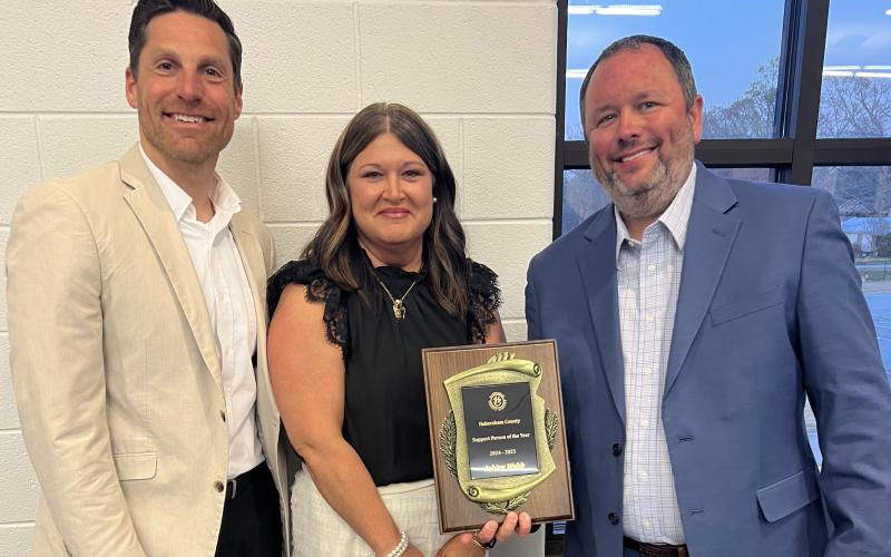 Support Person of the Year Ashley Webb stands with a smile between Assistant Superintendent David Leenman and Superintendent Patrick Franklin after Thursday’s ceremony. Webb is currently a special education administrative assistant at the Central Office, and has worked with parents and special education students in the Habersham County School System for nine years. SUBMITTED