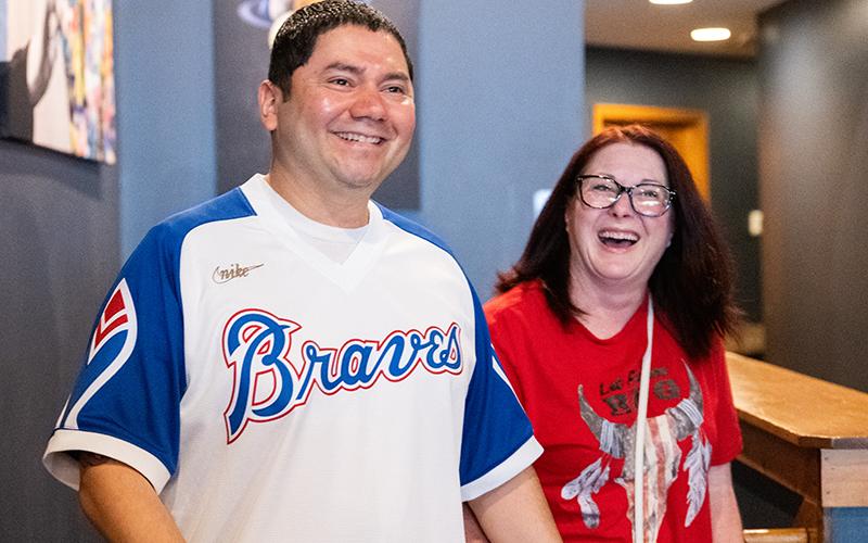 CWO-3 Saravia smiles as the crowd of people shouts, ‘Surprise!’ His wife, Jenny, at his side, was happy to see the support, and a plan to make a special moment for her husband turned out to be a success. ZACH TAYLOR/Staff