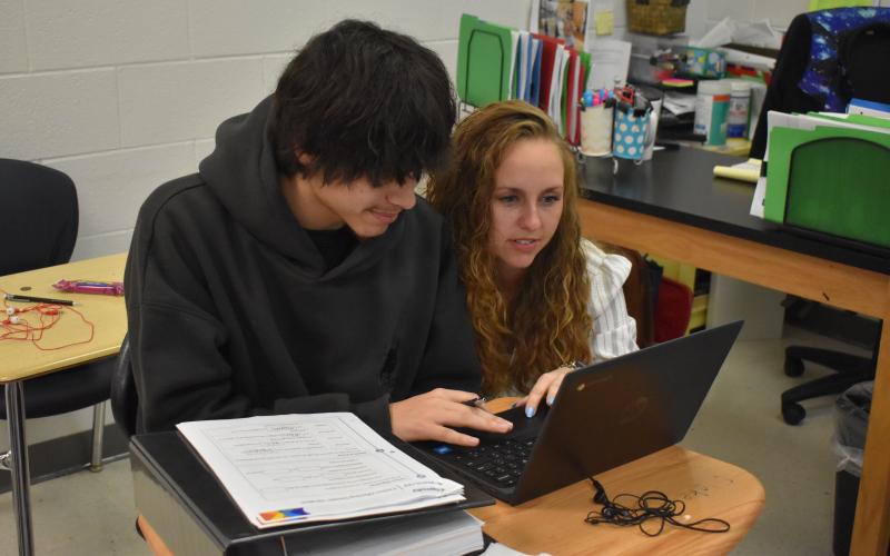 Habersham Success Academy Teacher Candace Carver (right) helps one of her students, Alejandro Rodriguez (left) on an early morning at the Habersham Success Academy. Carver is this year’s Teacher of the Year for the Habersham County School district, an honor she says is humbling. SAMANTHA SINCLAIR/Staff