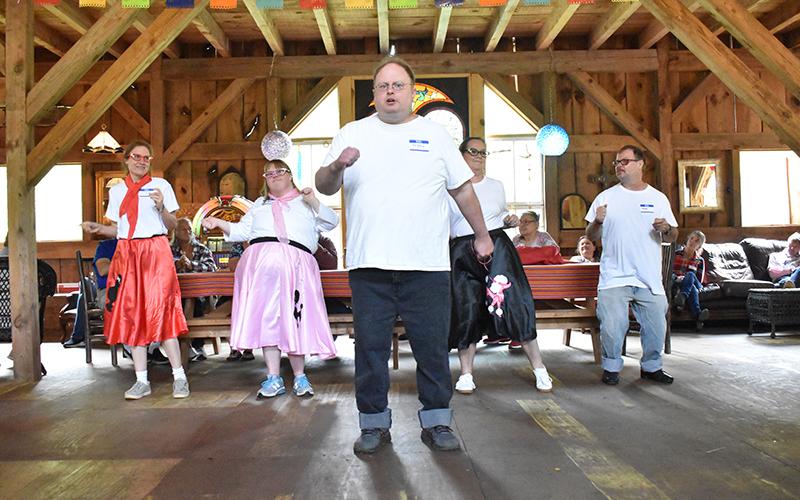 Scott Raven does his famous rendition of ‘I’m All Shook Up’ by Elvis Presley, while other Dream Weavers in slicked-back hair and poodle skirts dance in the background to kick off the Dream Weavers 25 year celebration. HANNAH CAUDELL/Staff