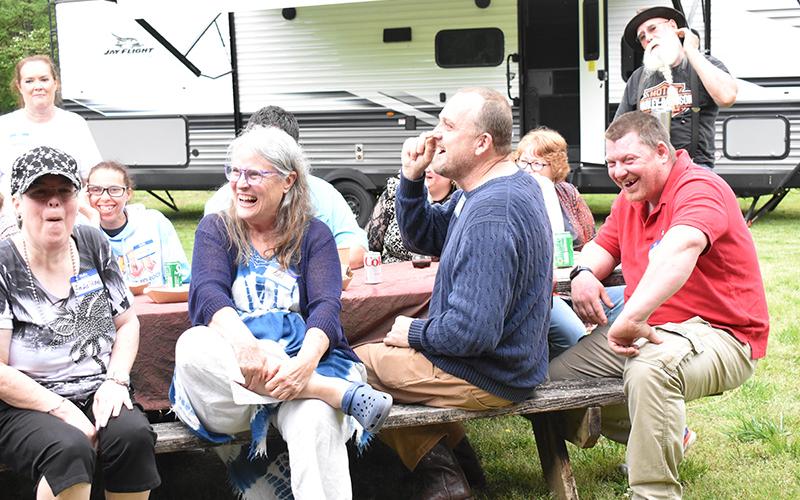Sandy Lyndon (left) and Billy Cannon (right) crack up as the recognition ceremony begins with funny stories about the Dream Weaver group’s many adventures. HANNAH CAUDELL/Staff