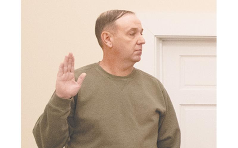 After serving 14 years on the city council (shown above being sworn in in 2024), Adam Tullis has submitted his resignation and plans to run for mayor. (File)