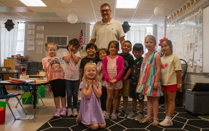 Hazel Grove Elementary School Principal Dr. Tim Goss visits a group of students during the school day, all of whom were excited to see him walk through the door. Goss has spent nine nonconsecutive years at Hazel Grove, returning in 2022 to serve as the school’s principal before retirement. HANNAH CAUDELL/Staff