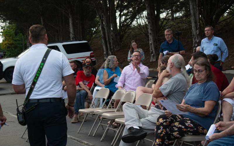 Tom Whitney, a resident of Baldwin, addresses the crowd to say that there needs to be more trust between the Baldwin City Council and the residents that live within the city limits. HANNAH CAUDELL/Staff