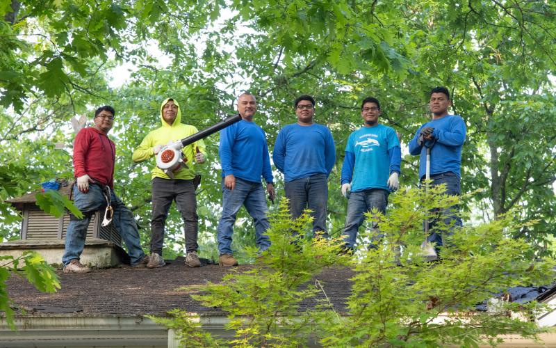 Steevan Carreto, Chavalo Carreto, Badilio Nox, Ronald Carreto, Elias Carreto and Victor Gonzalez of Patriot Roofing pose for a photo on the roof of Jim Morgan's house during the project. ZACH TAYLOR/Staff