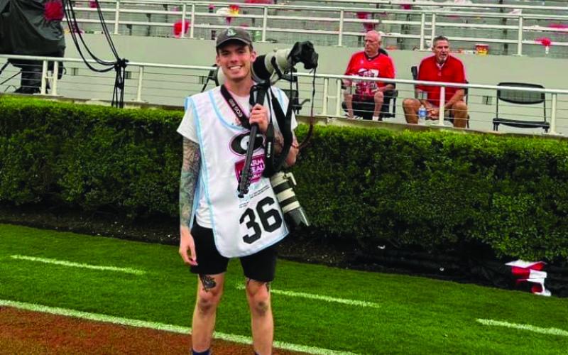 UBMITTED Landen Todd covers a football game for The Red &amp; Black.