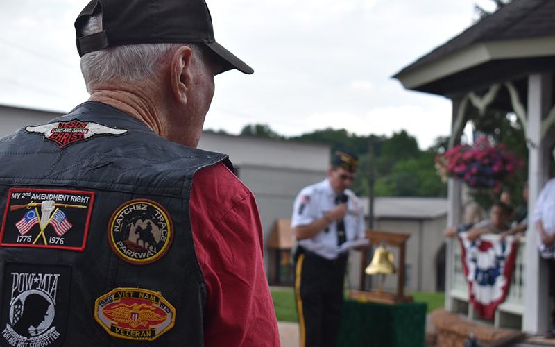 Vietnam War Army Veteran Wayne Cone listens as American Legion Commander Jim Morgan addresses the crowd gathered in Clarkesville. Samantha Sinclair/Staff