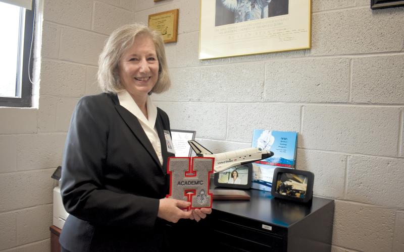 Martha Cantrell is surrounded by memories of her career at both Tallulah Falls School and Habersham County Schools in her office. ‘This has touched hundreds of kids, and I hope in a positive way,’ she said, holding an academic letter. Samantha Sinclair/Staff