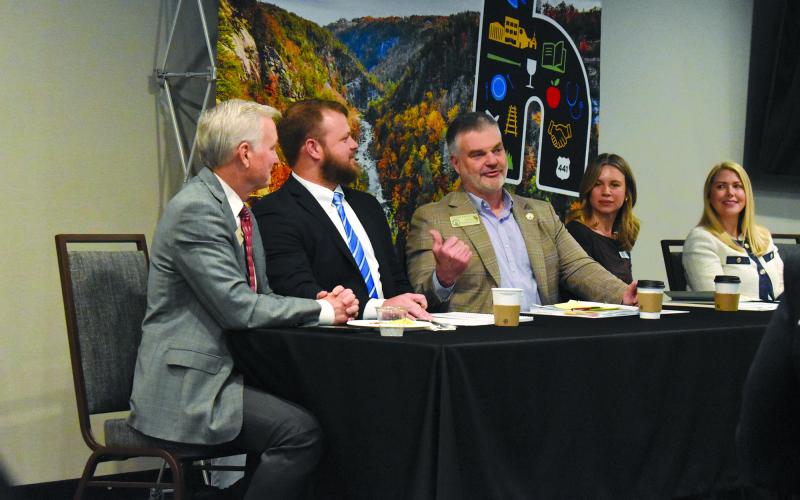 Rep. Victor Anderson explains how he and Sen. Bo Hatchett and Rep. Chris Erwin work together as a team during the Post-Legislative Breakfast panel discussion as Nancy Palmer of the Georgia Chamber of Commerce listens. Samantha Sinclair/Staff