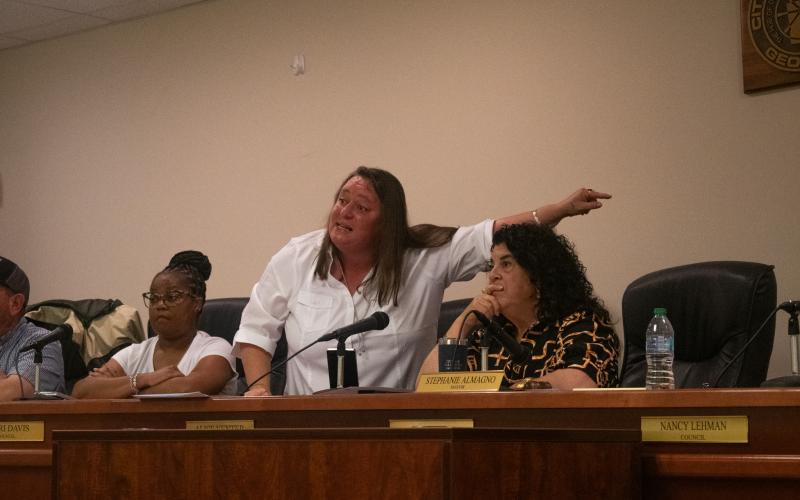 Baldwin Councilwoman Alice Venter, left, stands to her feet next to Mayor Stephanie Almagno to explain what the public works department does for the city to justify their take-home vehicles, as well as other utility vehicles that are paid for with SPLOST dollars and maintained through public dollars. HANNAH CAUDELL/Staff