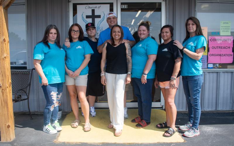 Jessica and Cody Montgomery of Levi’s Ministries stand with the women who are currently participating in the Levi’s House women’s rehabilitation program. Pictured from left are Amanda Phelps, Leah Farmer, KC Corriera, Cody and Jessica Montgomery, Amanda Dunn-Wall, Kristi Moore, and Misty Woods. Not pictured is Daisy Campbell. HANNAH CAUDELL/Staff