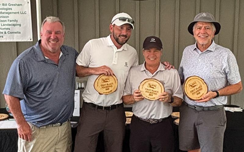 Soque River Watershed Association board member Rob Bennison, left, poses with first place gross winners Chad Streetman, Conrad Lauten and Mark Sharitz. (Submitted)