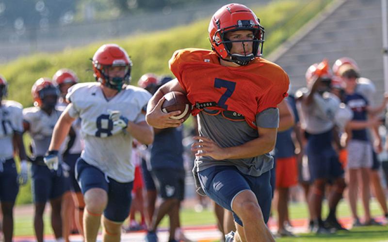 Habersham Central quarterback Paris Wilbanks runs with the ball during the first day of the padded camp on Tuesday, June 24 at Raider Stadium. (LANDEN TODD/Staff)