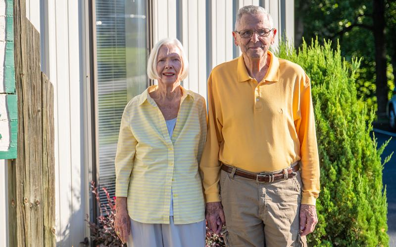 Lea and Len Cohen stand outside the Sharing and Caring building where they have volunteered for decades. (Zach Taylor/Staff)